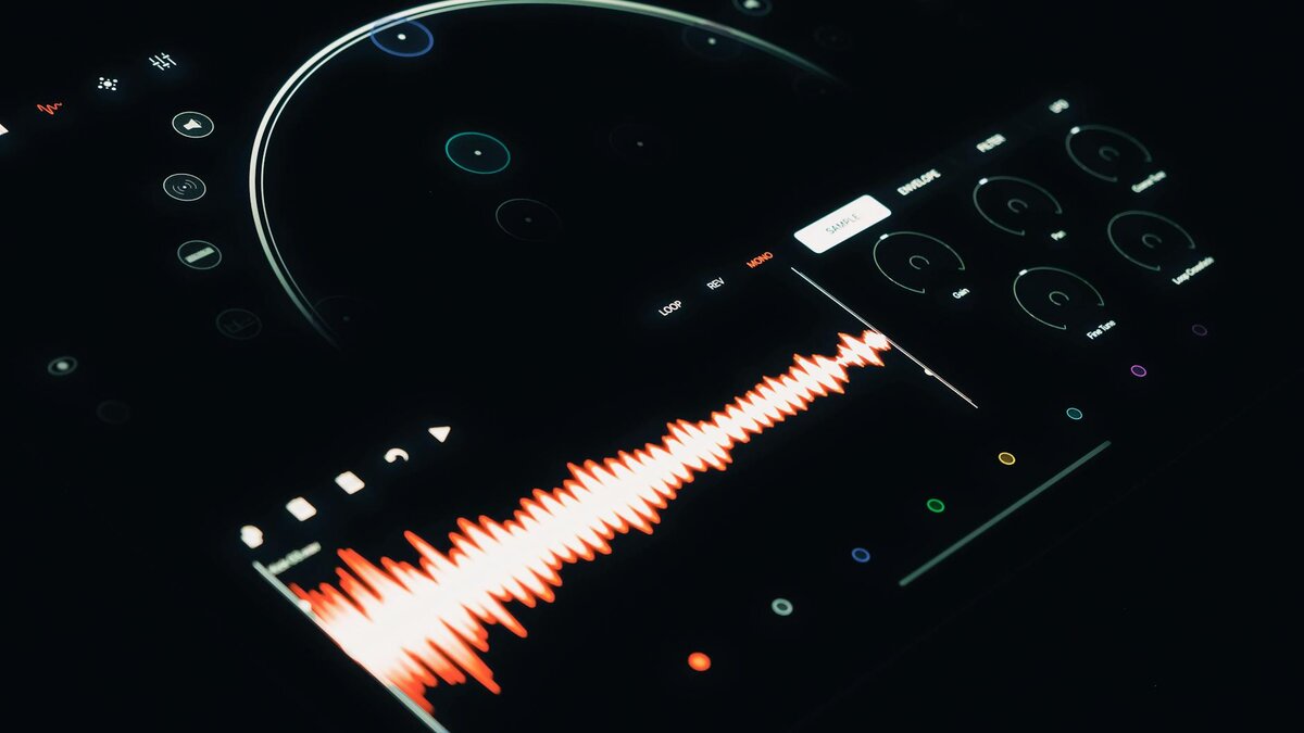 Studio audio interface with orange waveform showing voice synthesis output